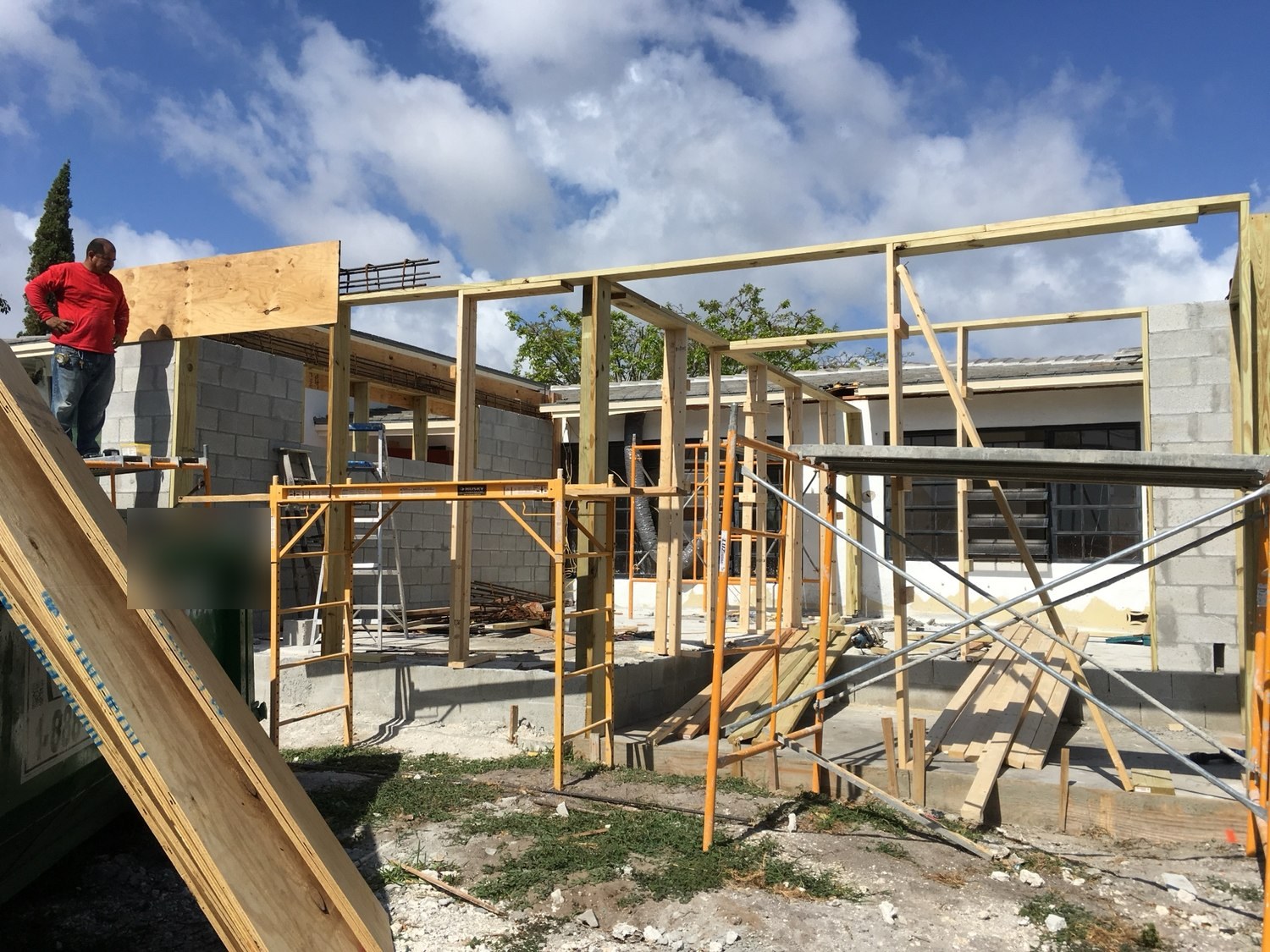 Timber formwork and shoring built above the block walls to cast the floating tie beam