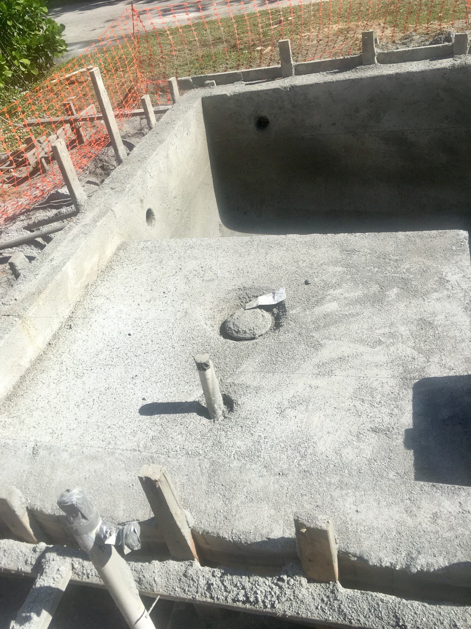 Sprayed concrete pool shell with the bench and steps formed