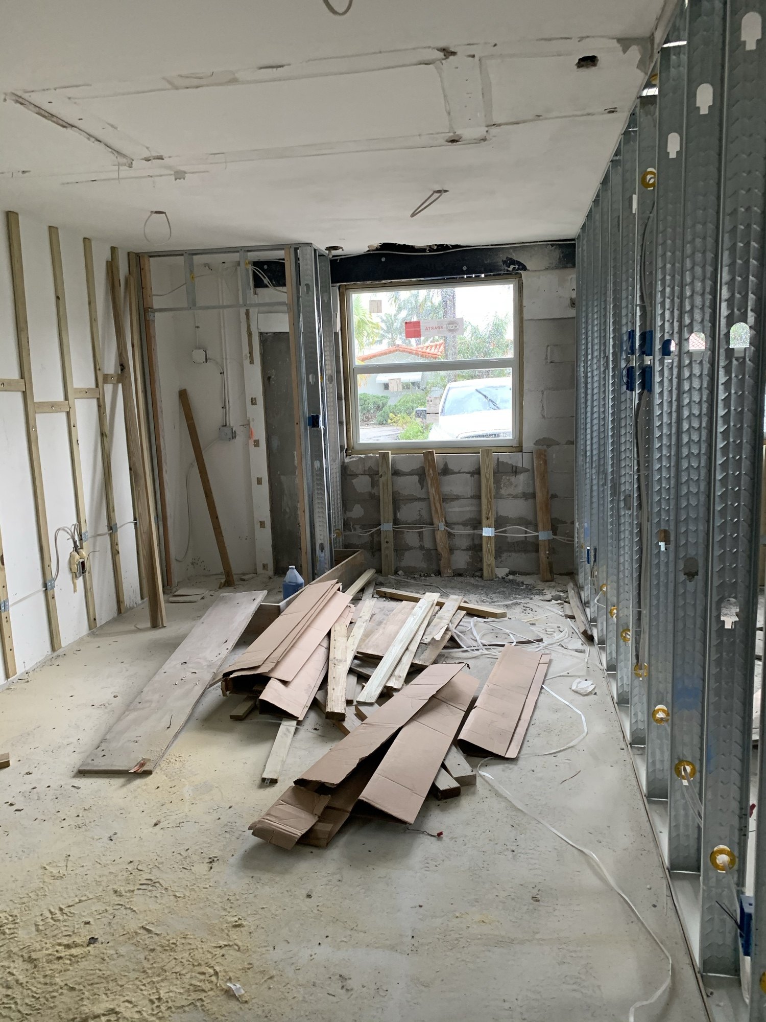 Interior of the converted space with drywall hung and insulation in the exterior wall