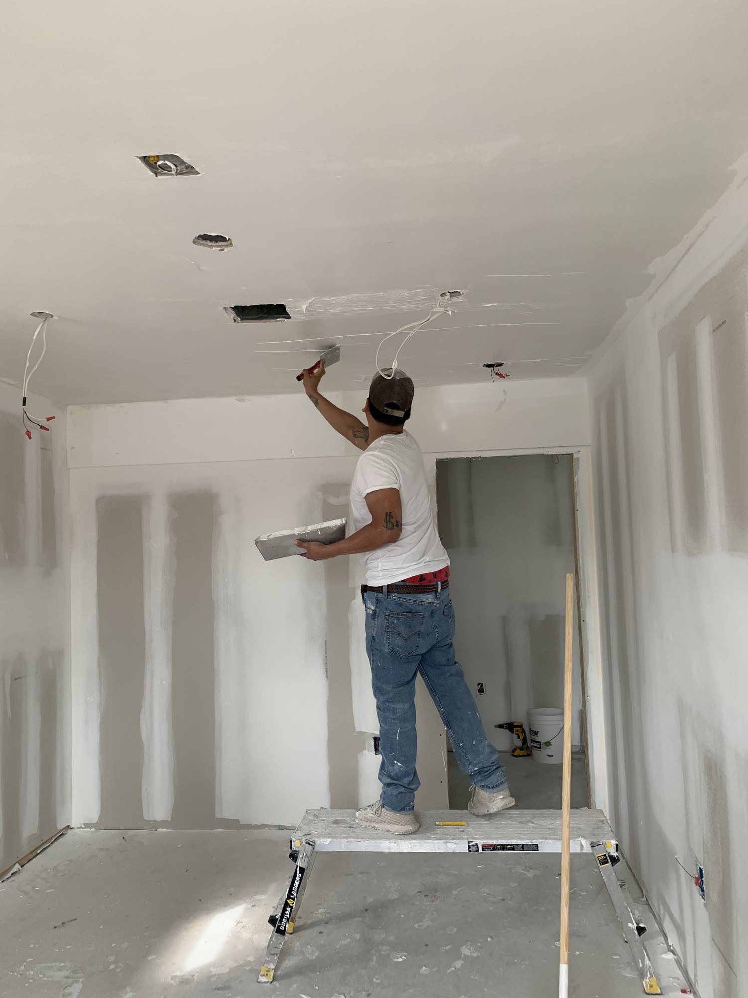 Taping and floating drywall joints before paint