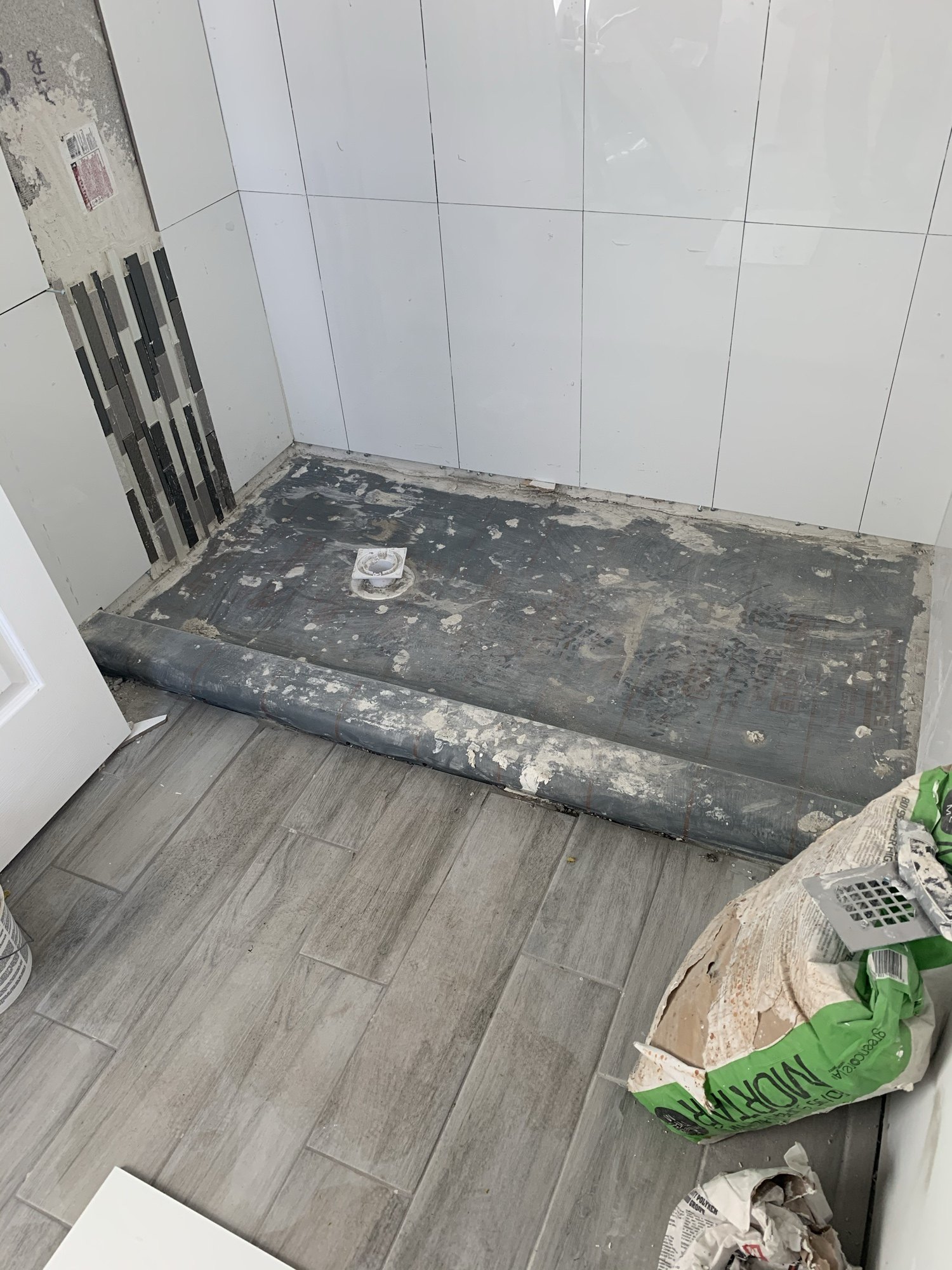 Plank flooring being laid over the levelled slab