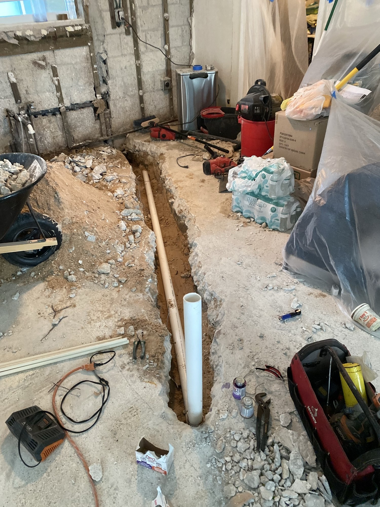 Slab trench with a new drain standpipe set before backfill