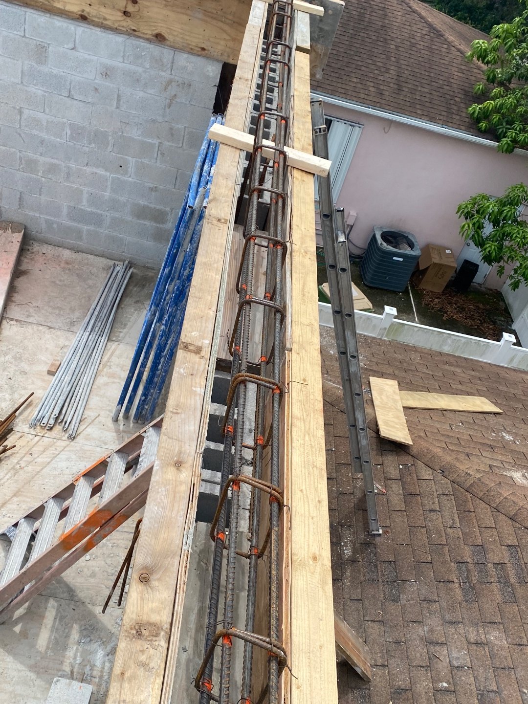 Reinforcing steel set inside the tie beam formwork before the concrete pour