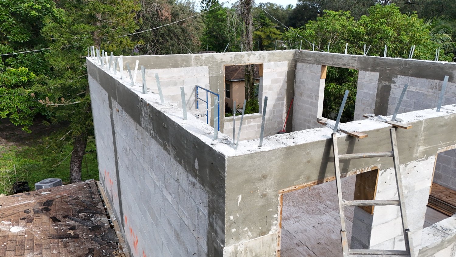 Interior block walls and the poured concrete tie beam framing out the rooms